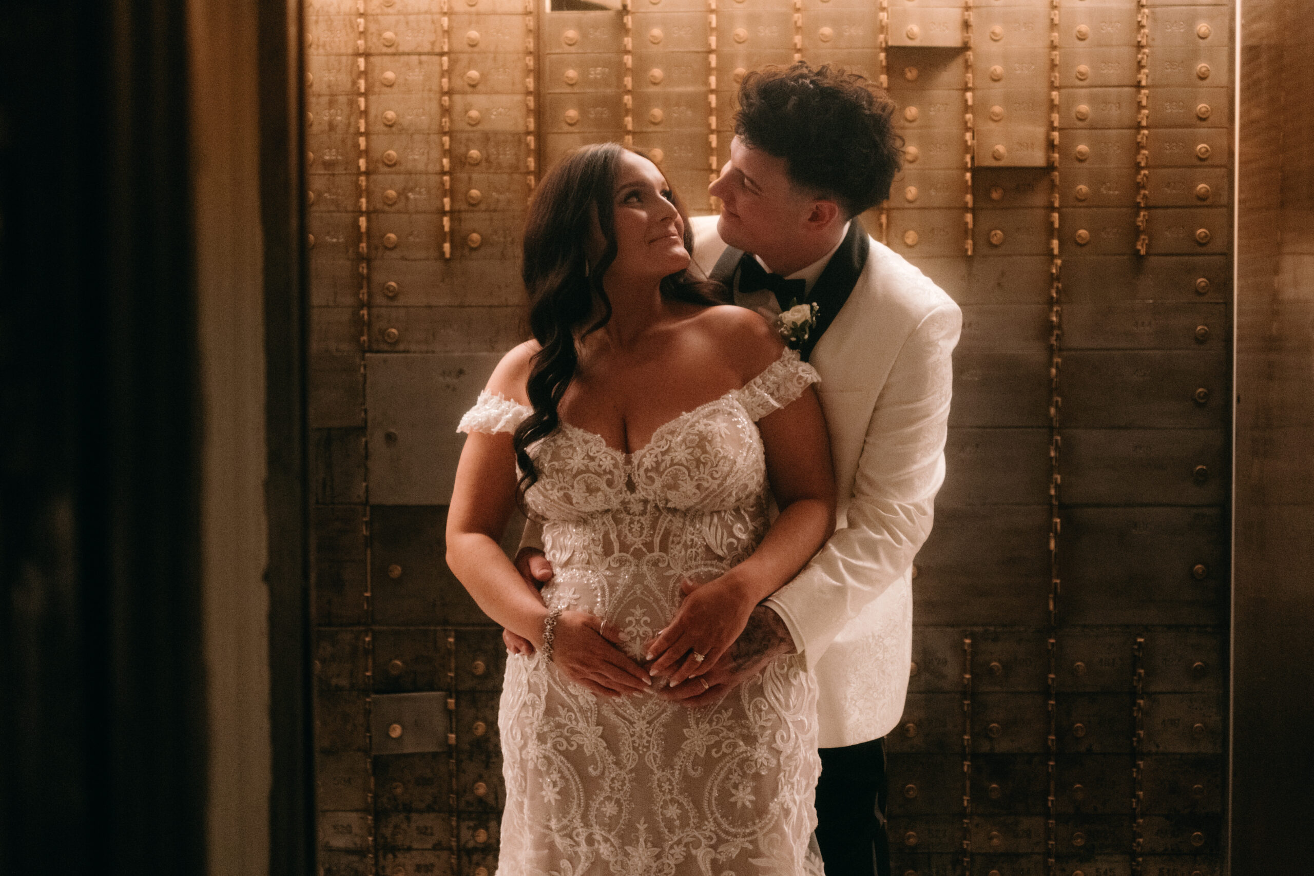 wedding portraits newlyweds look at each other inside vault634 vault old bank